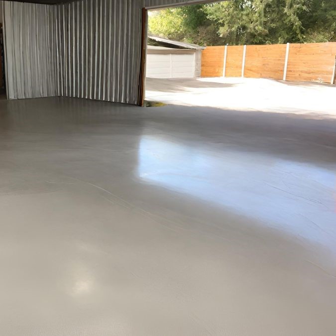 A freshly poured concrete floor for a garage in Cardiff
