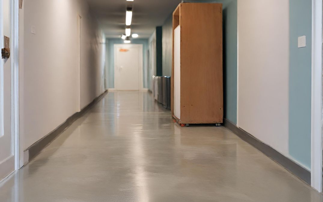 A hallway with a concrete overlay floor