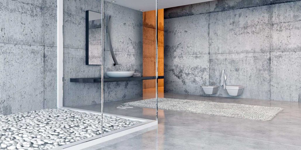 A bathroom with a polished concrete floor