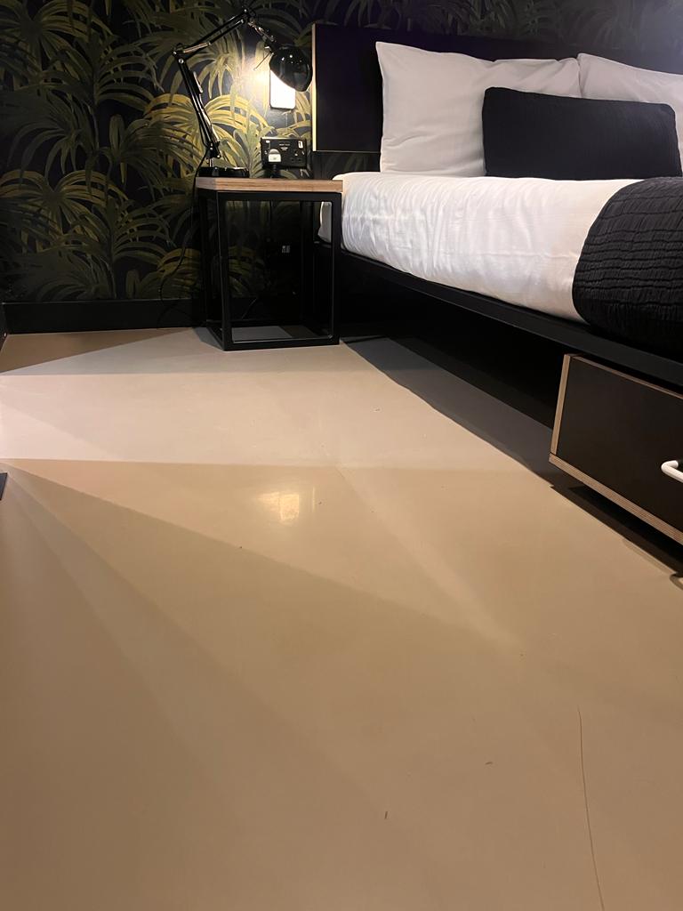 bedroom concrete polished flooring with a cream finish in Cardiff
