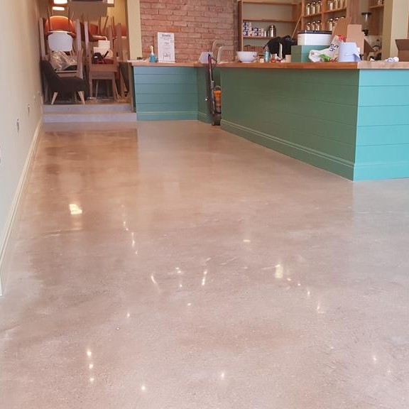 a cream finish on polished concrete flooring