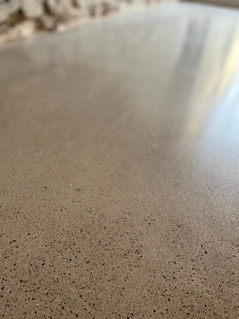 slightly exposed aggregate finish on a polished concrete floor