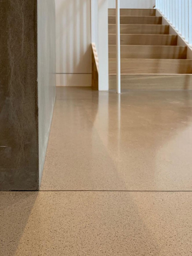 hallway and staircase with concrete polished flooring